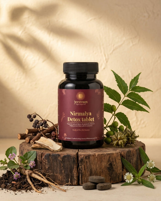 Nirmalya liver Detox Tablet bottle on a wooden platform with natural elements