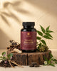 Nirmalya liver Detox Tablet bottle on a wooden platform with natural elements