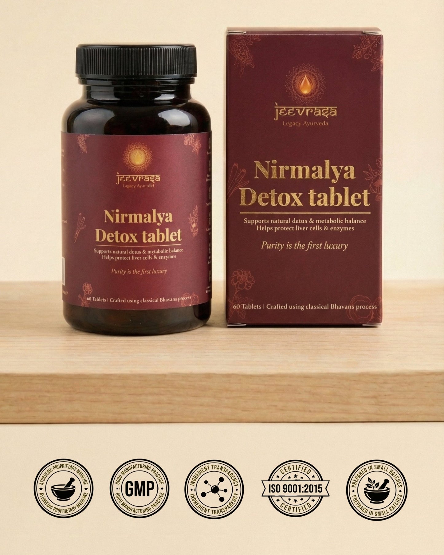 Nirmalya Detox tablet bottle and packaging on a wooden surface with certification logos at the bottom.